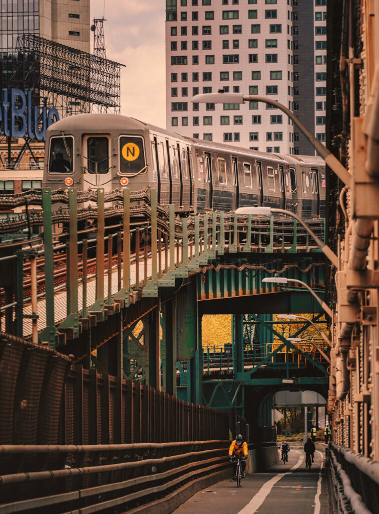 Decorative photo of the N Train in Queens